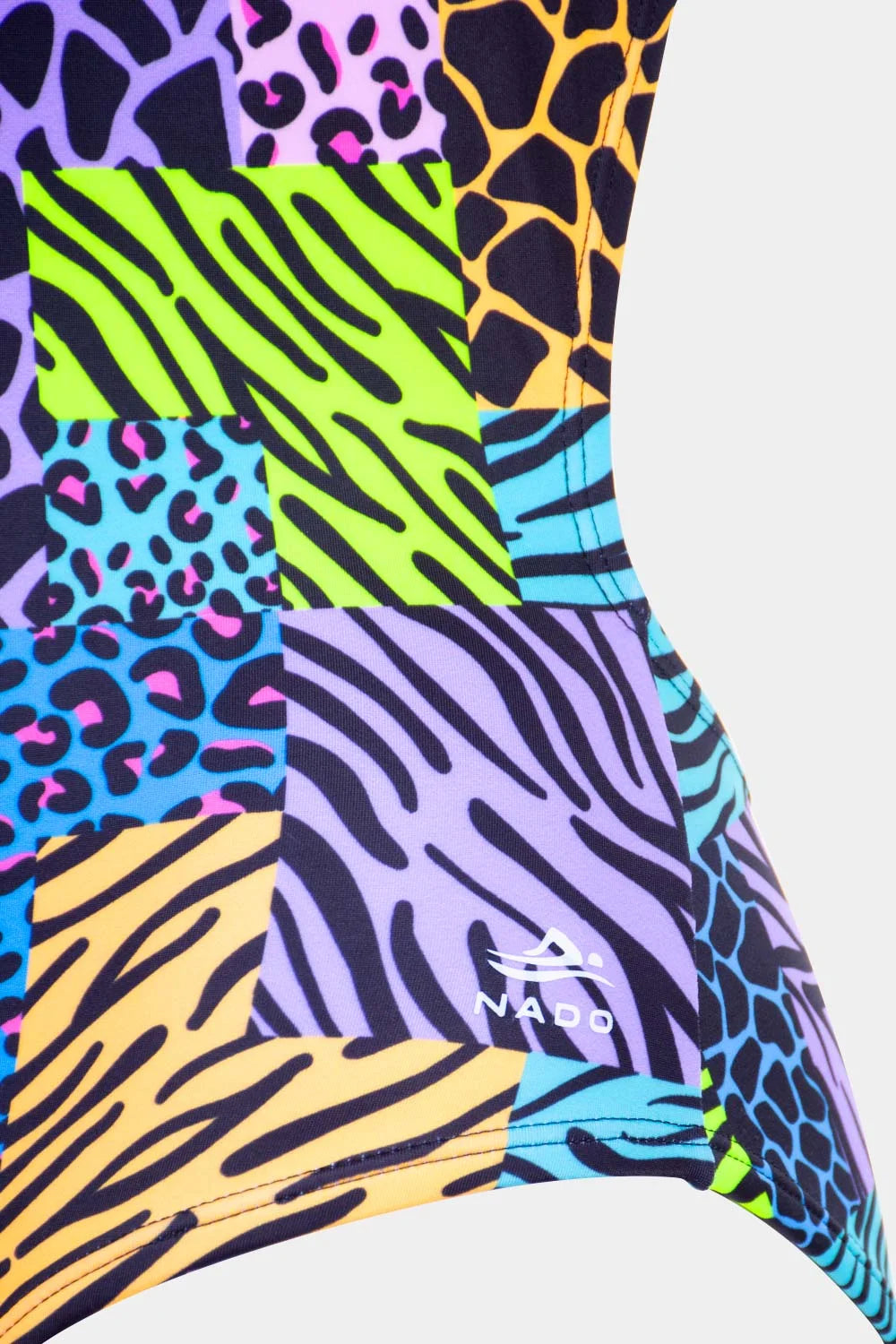 Women's printed one-piece in multicolor animal patchwork, fabric close-up – Bikini Uni