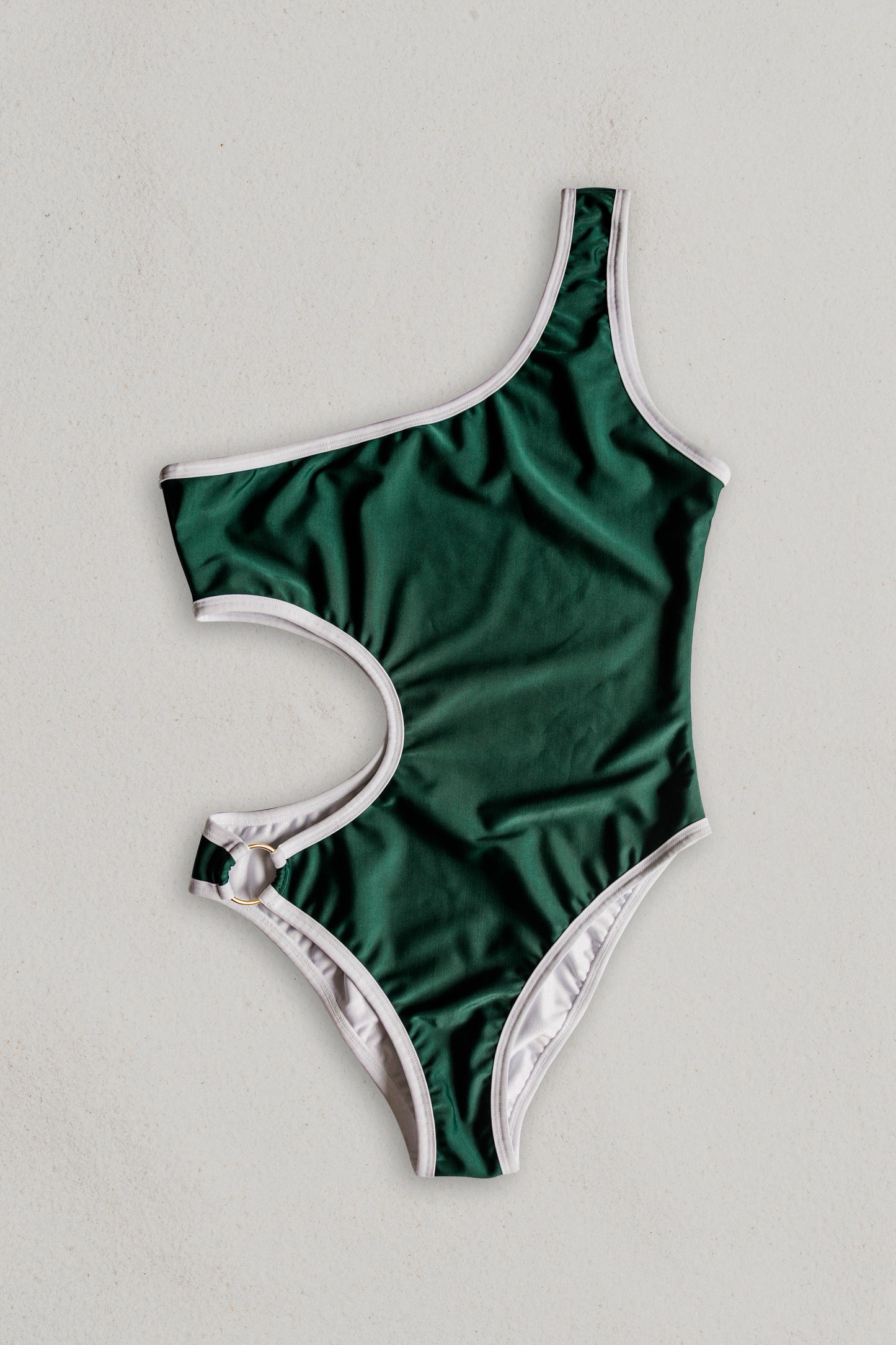 Boomerang one-piece swimsuit in green with white, front view – Bikini Uni