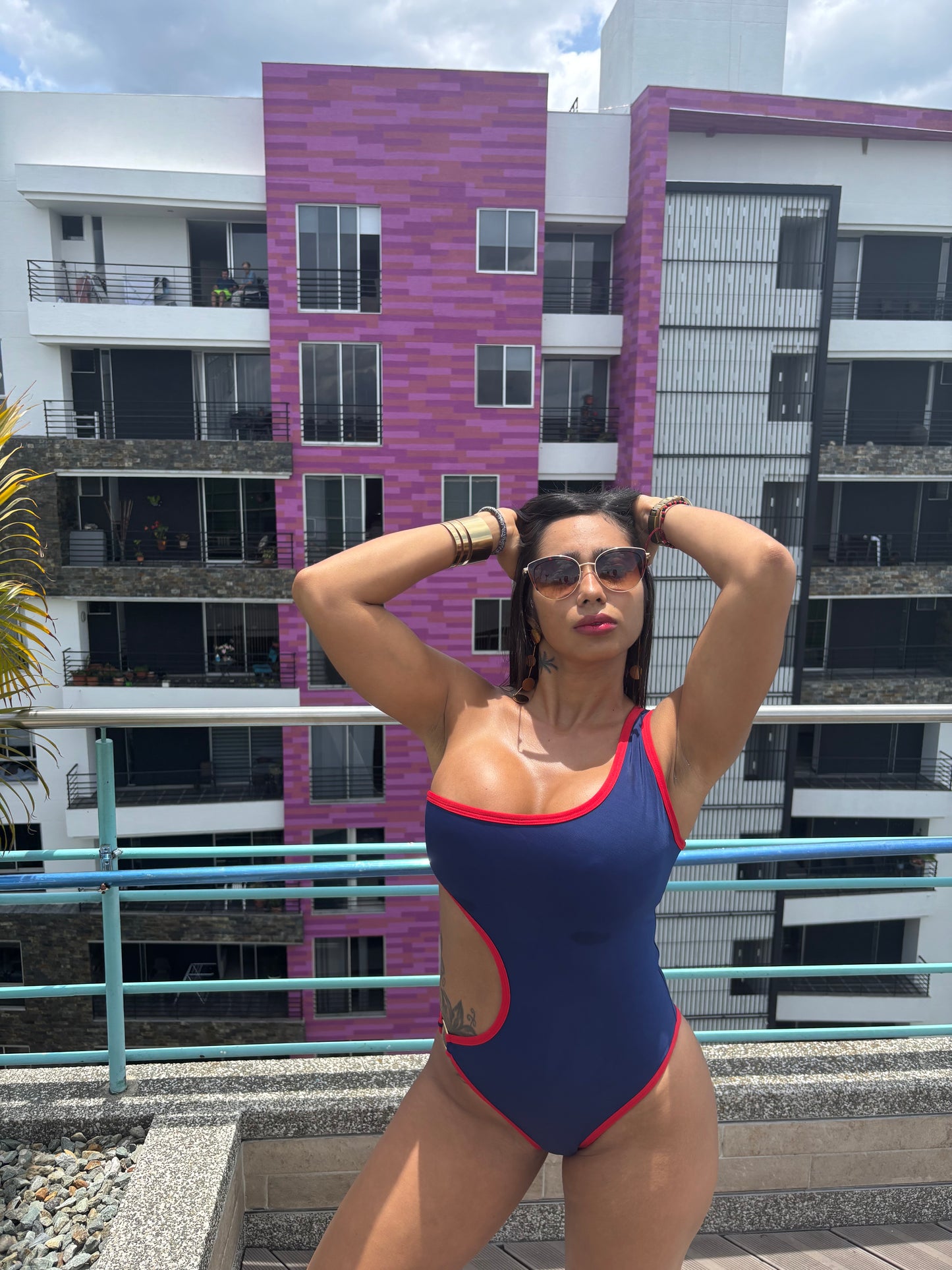 Boomerang one-piece swimsuit in navy with red, model lifestyle photo – Bikini Uni