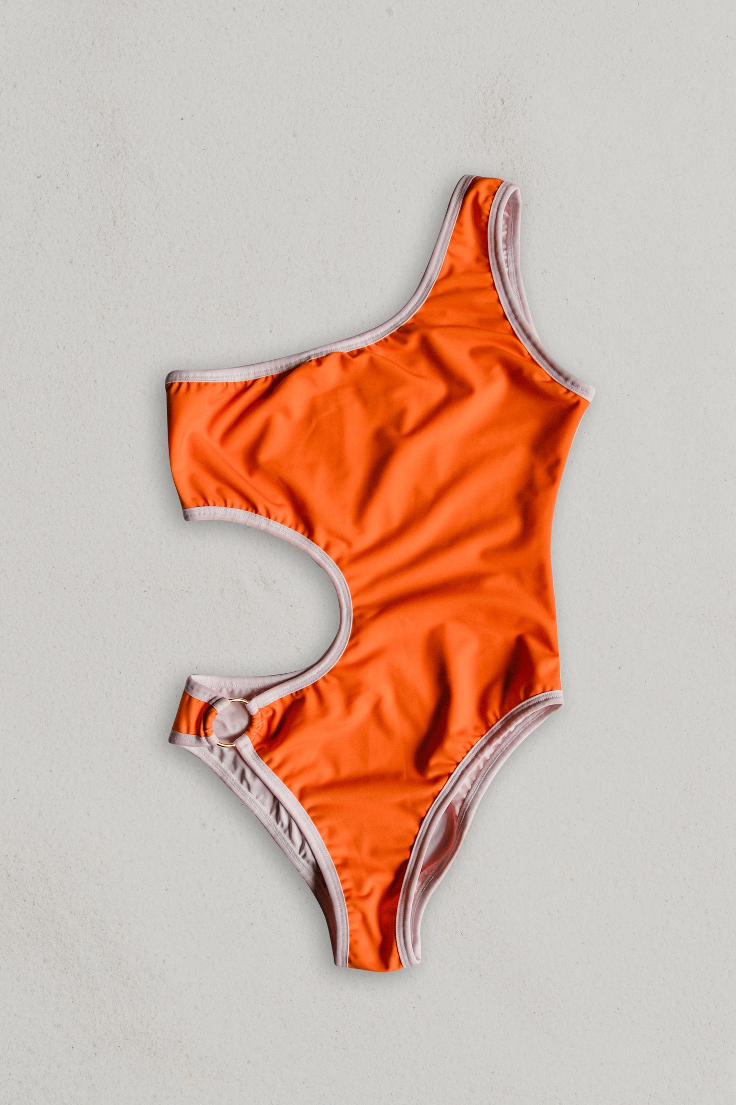 Boomerang one-piece swimsuit in orange with white, front view – Bikini Uni