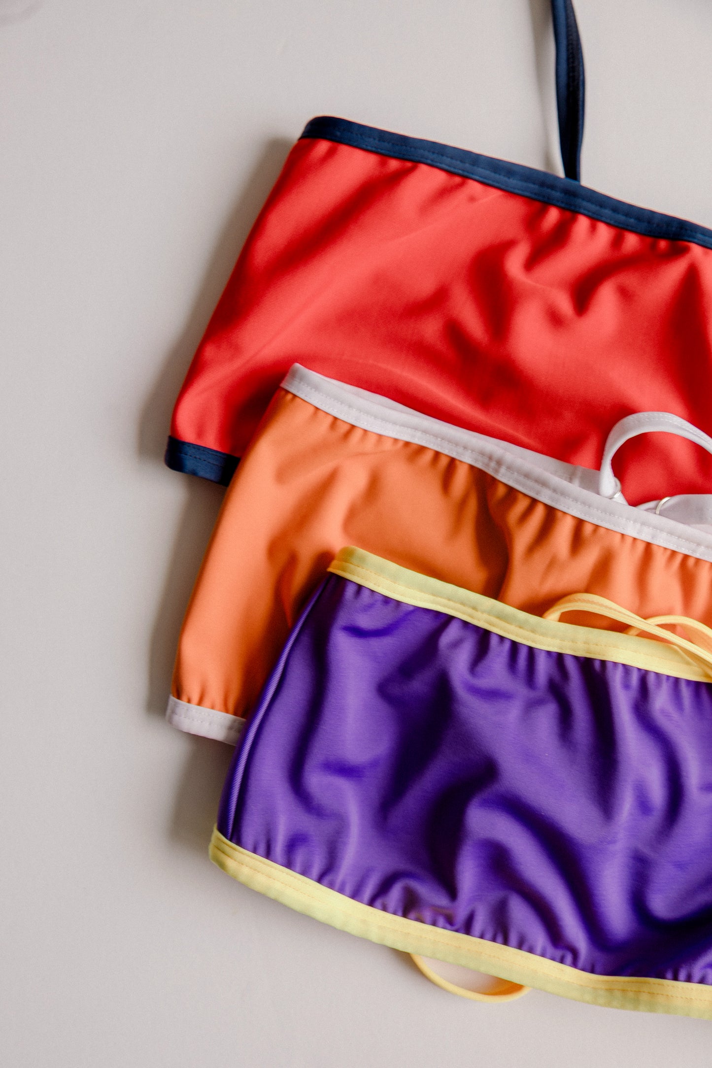 Dos Tierras bikini sets stacked in red orange and purple, all colors – Bikini Uni