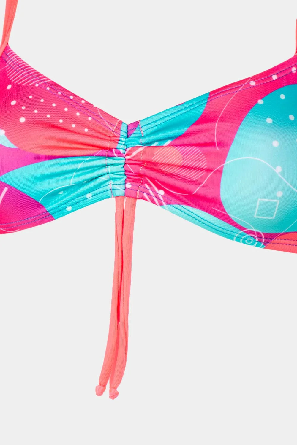 Women's sport bikini top in pink and blue abstract, close-up view – Bikini Uni